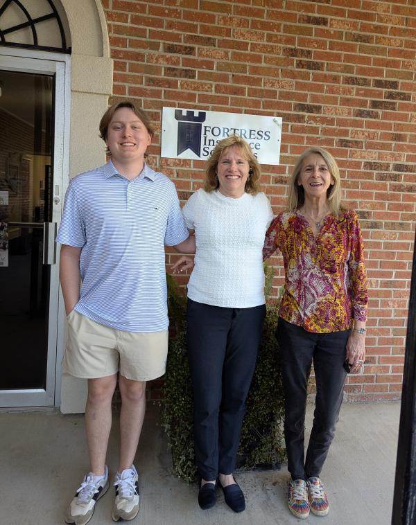 The Fortress Insurance Team Standing Outside Of The Office