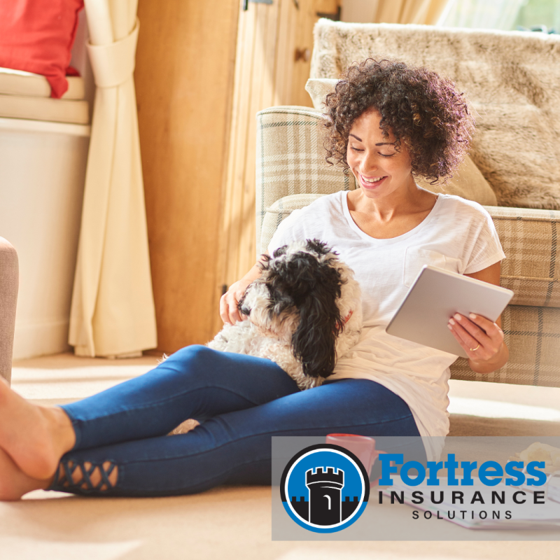 pet insurance a woman sits with a small dog on her lap